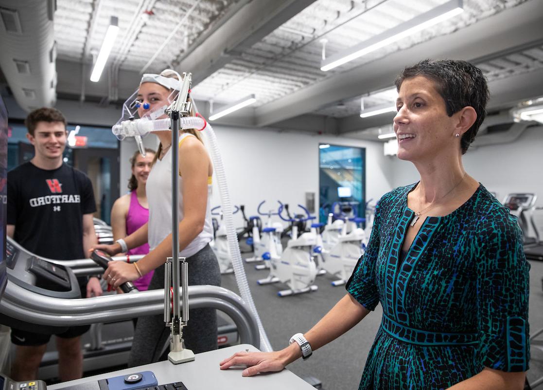 professor and student working in exercise science class